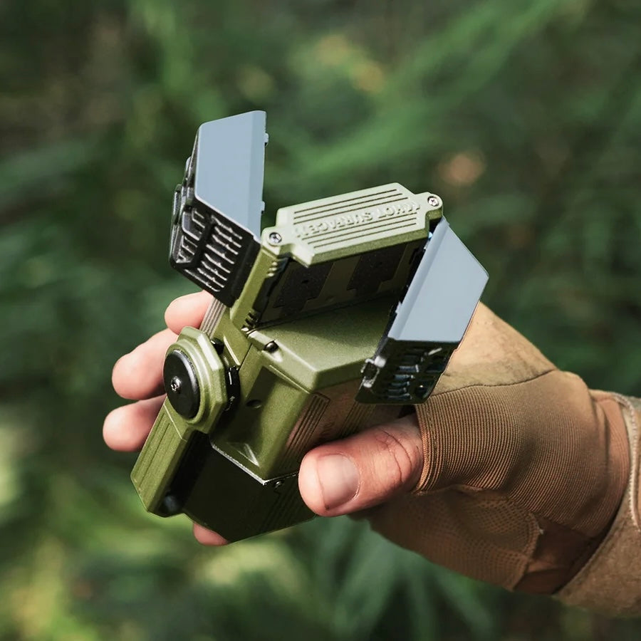 person holding forest green Nomadia Accessory All-in-One Outdoor Mosquito Repeller & Light, insertion socket for mosquito repellent pads - camping gear - camping light - insect repeller