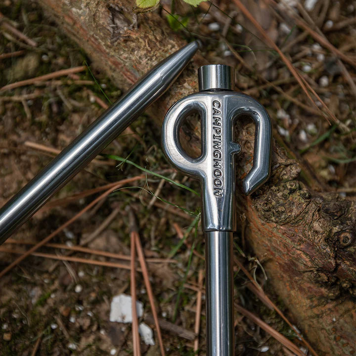close up of Nomadia Accessory Camp Peg for Pet against a wooden background - camping gear
