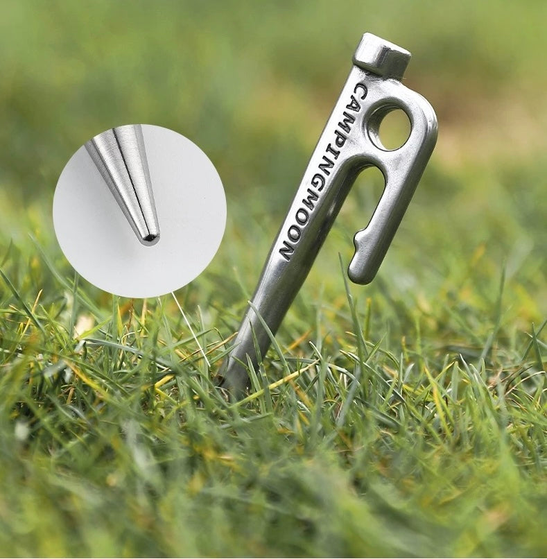 Nomadia Accessory Forged Camp Pegs Metal tent peg with close up showing round tip - camping gear - camping essential
