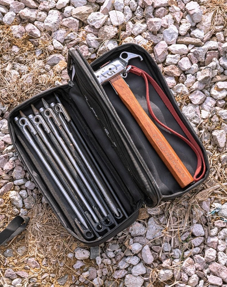 Black tool case with Nomadia Accessory Forged Camp Pegs and hammer - portable - camping essential - camping gear