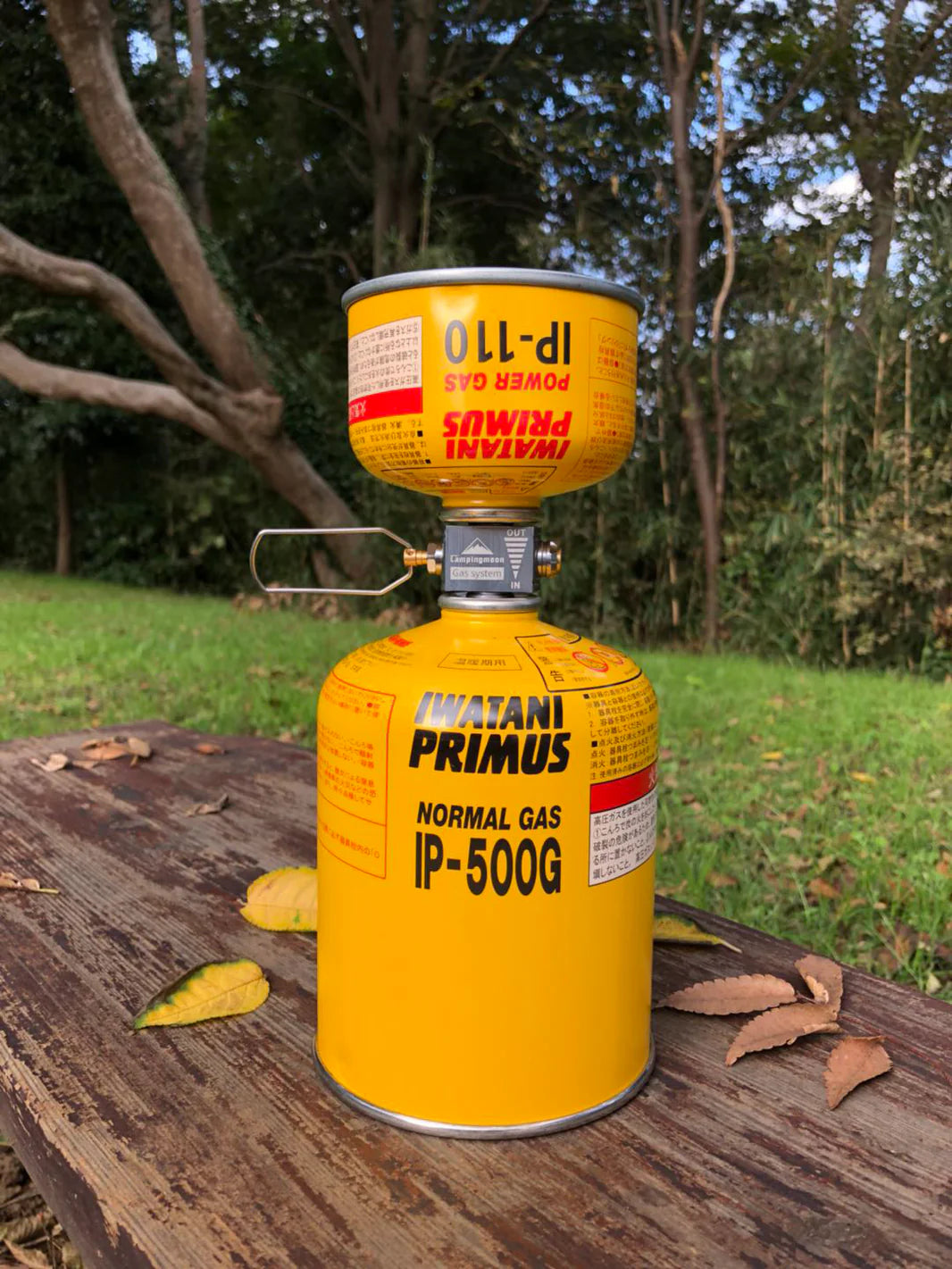 nomadia accessory Fuel Canister Refill Adapter in use with two different sized gas canisters - camping gear - camping accessory