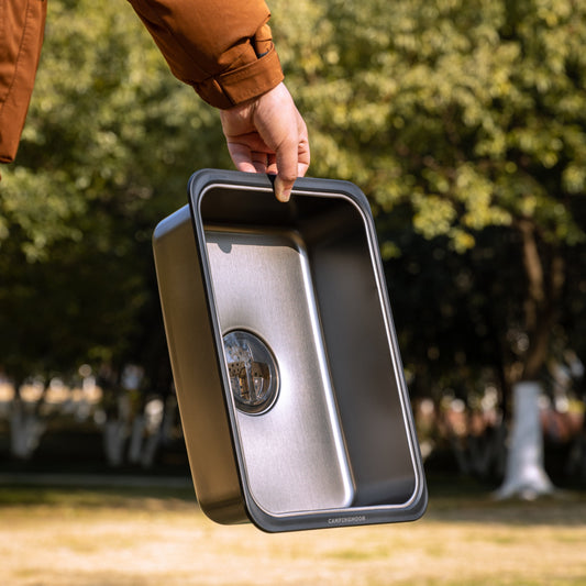 Person holding Nomadia CampStation Kitchen Sink outdoors - modular flexibility - modular fit - camping gear -outdoor cooking and washing equipment