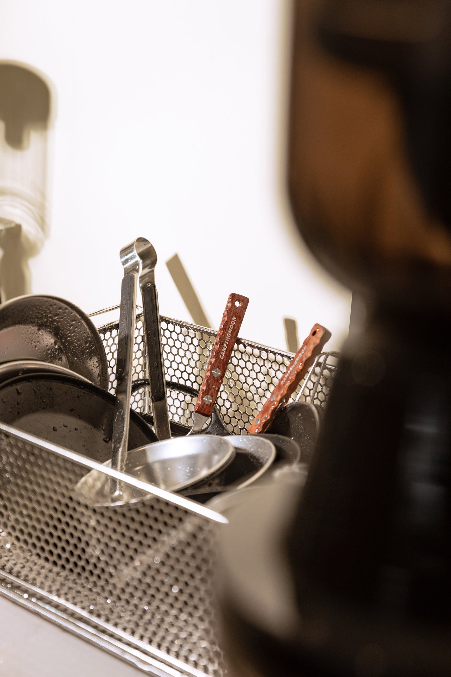metal mesh basket works as Dish rack with dirty dishes and utensils - multi-use - multi purpose camping gear - uk camping