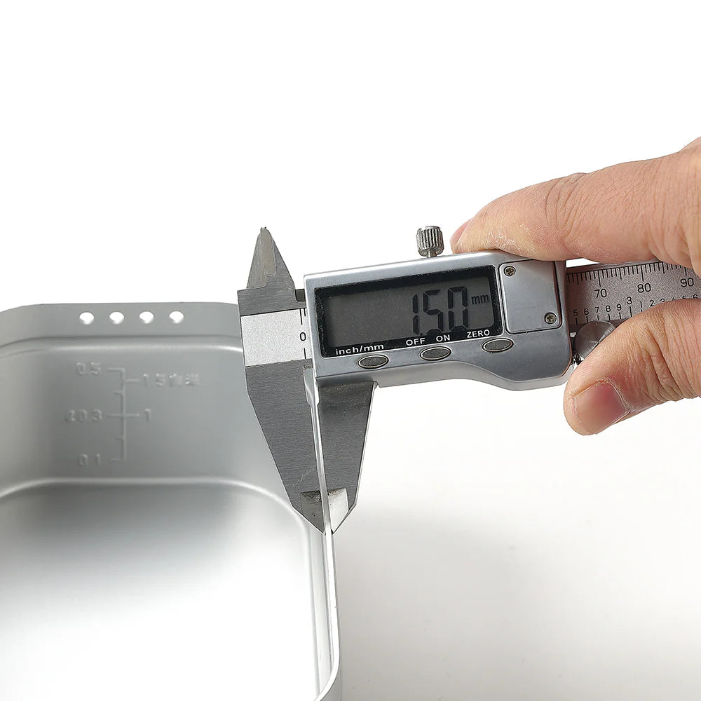 close up of Digital caliper measuring thickness of Nomadia CampStation Outdoor Aluminium Lunch Box - camping gear - outdoor cooking utensil