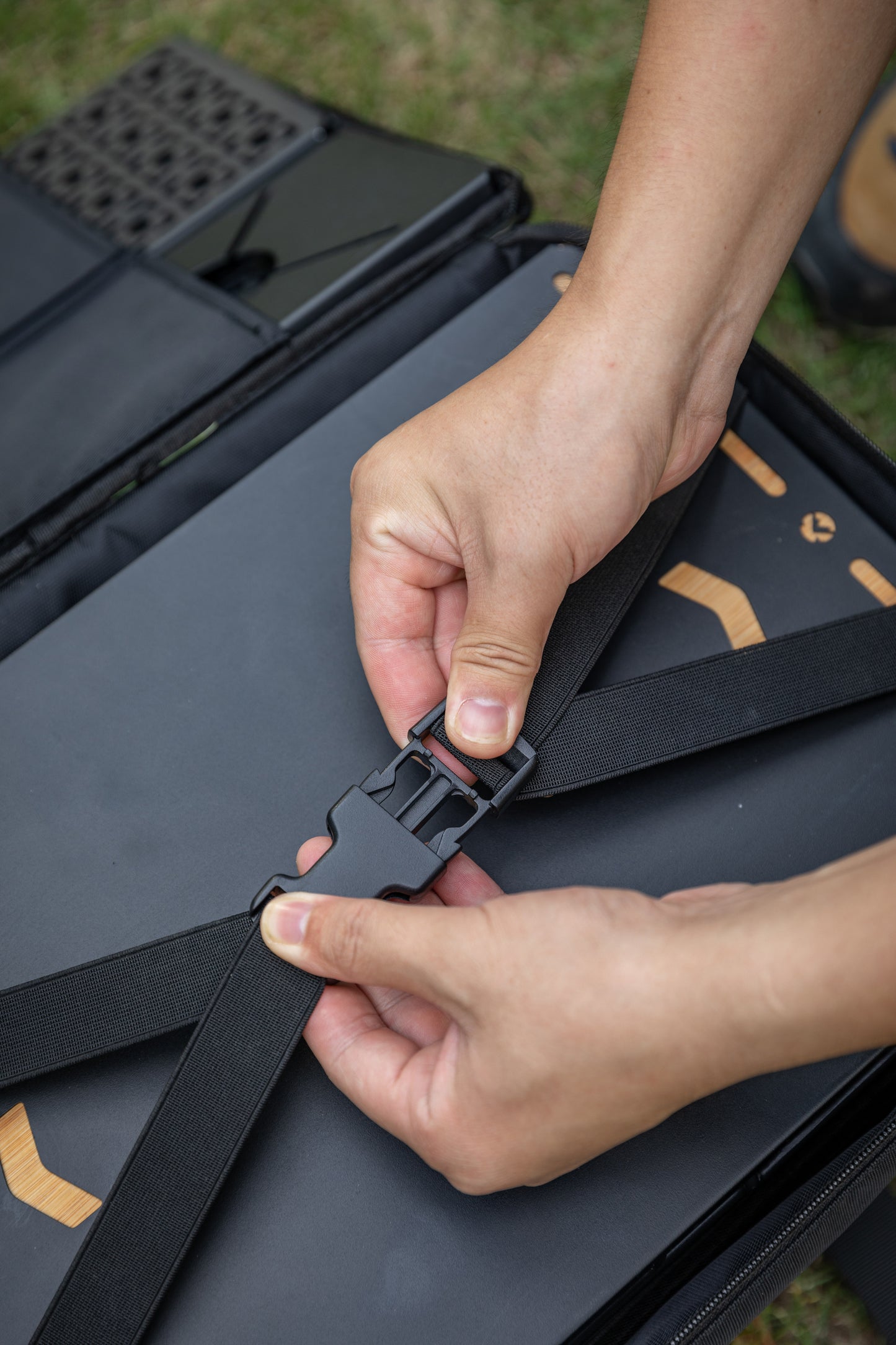 close up of the safety strap black Nomadia CampStation Storage Bag large storage camper bag with compartments for modular camping table