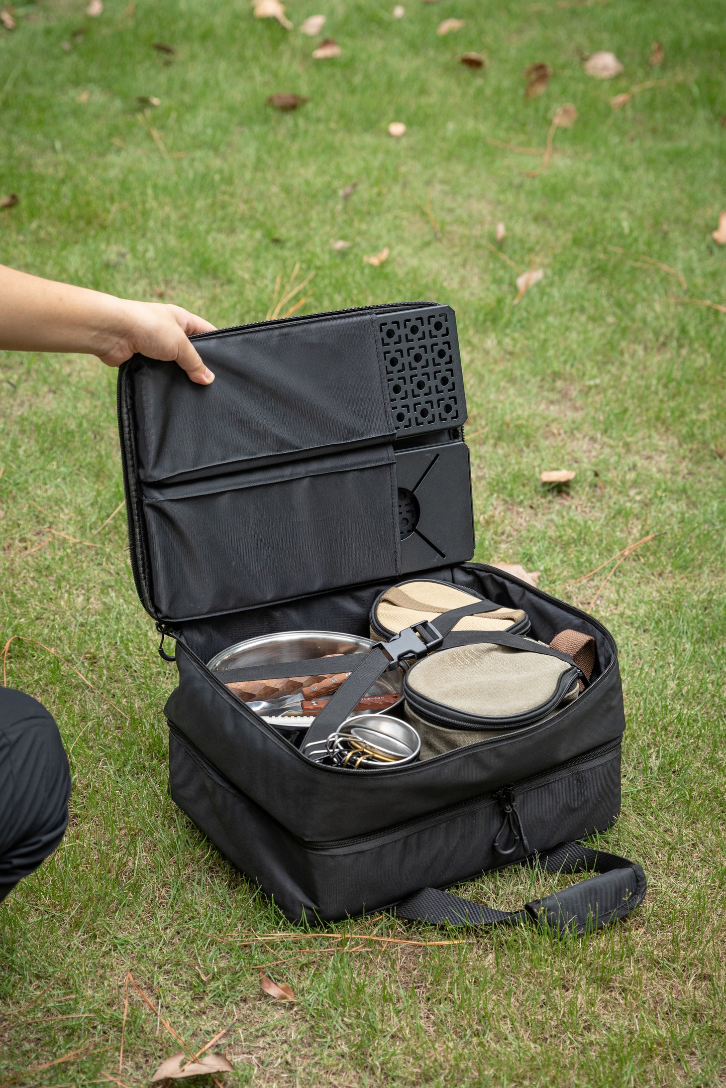 Black outdoor cooking set with pots and pans in Nomadia CampStation Storage Bag -large camper bag with compartments - uk camping