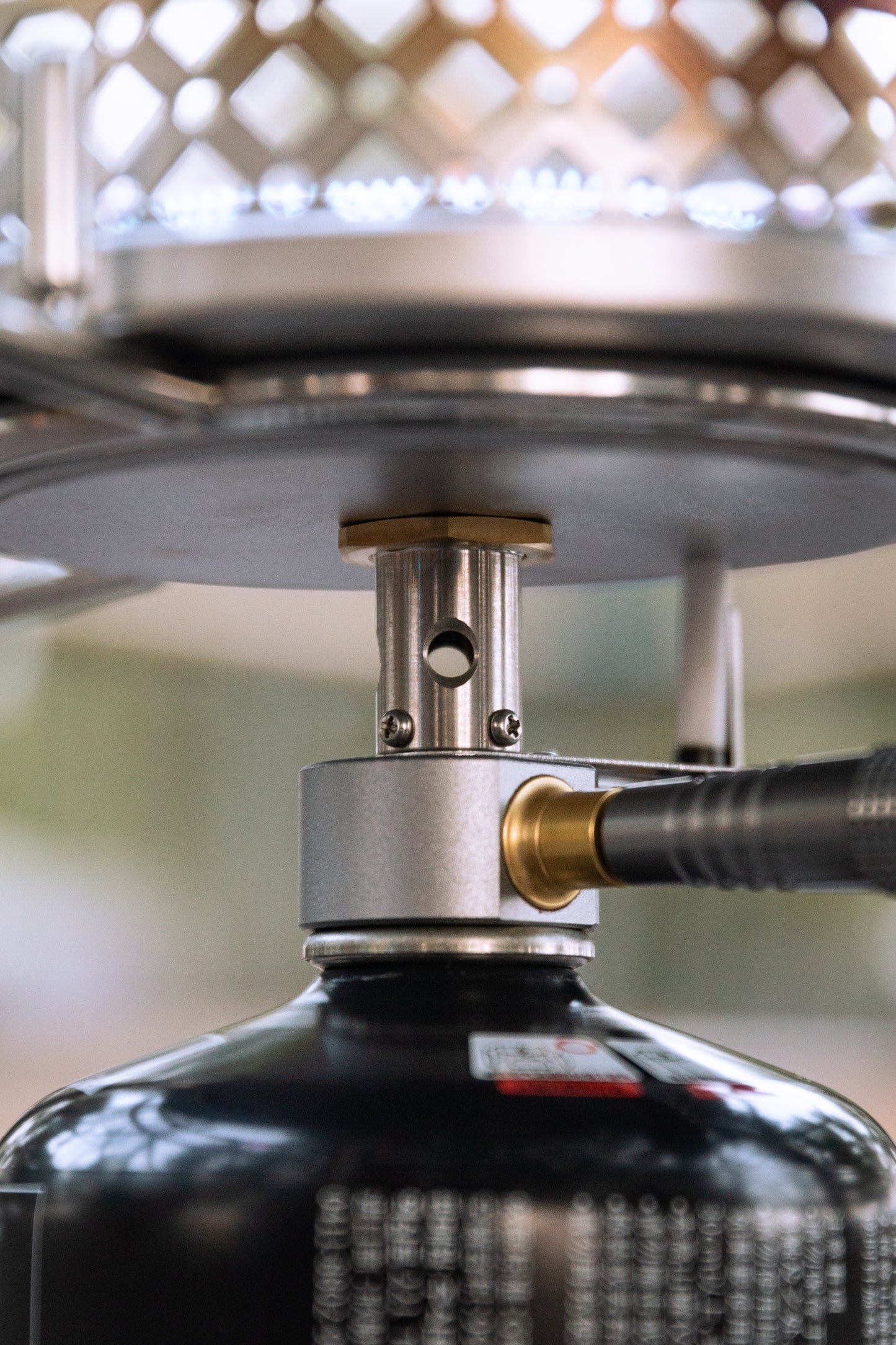 Close-up of a gas cylinder with a metallic nozzle for Nomadia CampStation Stove Set cooking stove for camping - uk camping - outdoor cooking equipment