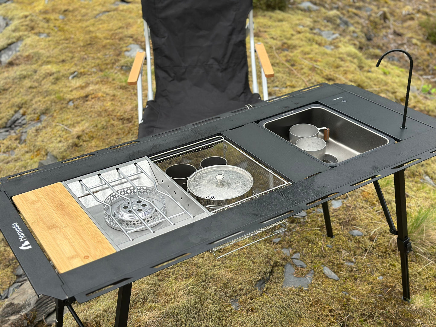 Nomadia_CampStation Portable Folding Heavy Duty Compact - Camping Table Table Set with Modular Flexibility - Modular Camping Table water dispenser - stainless steel coffee pot - stove set - sink - mesh basket - camping - lifestyle - grassland