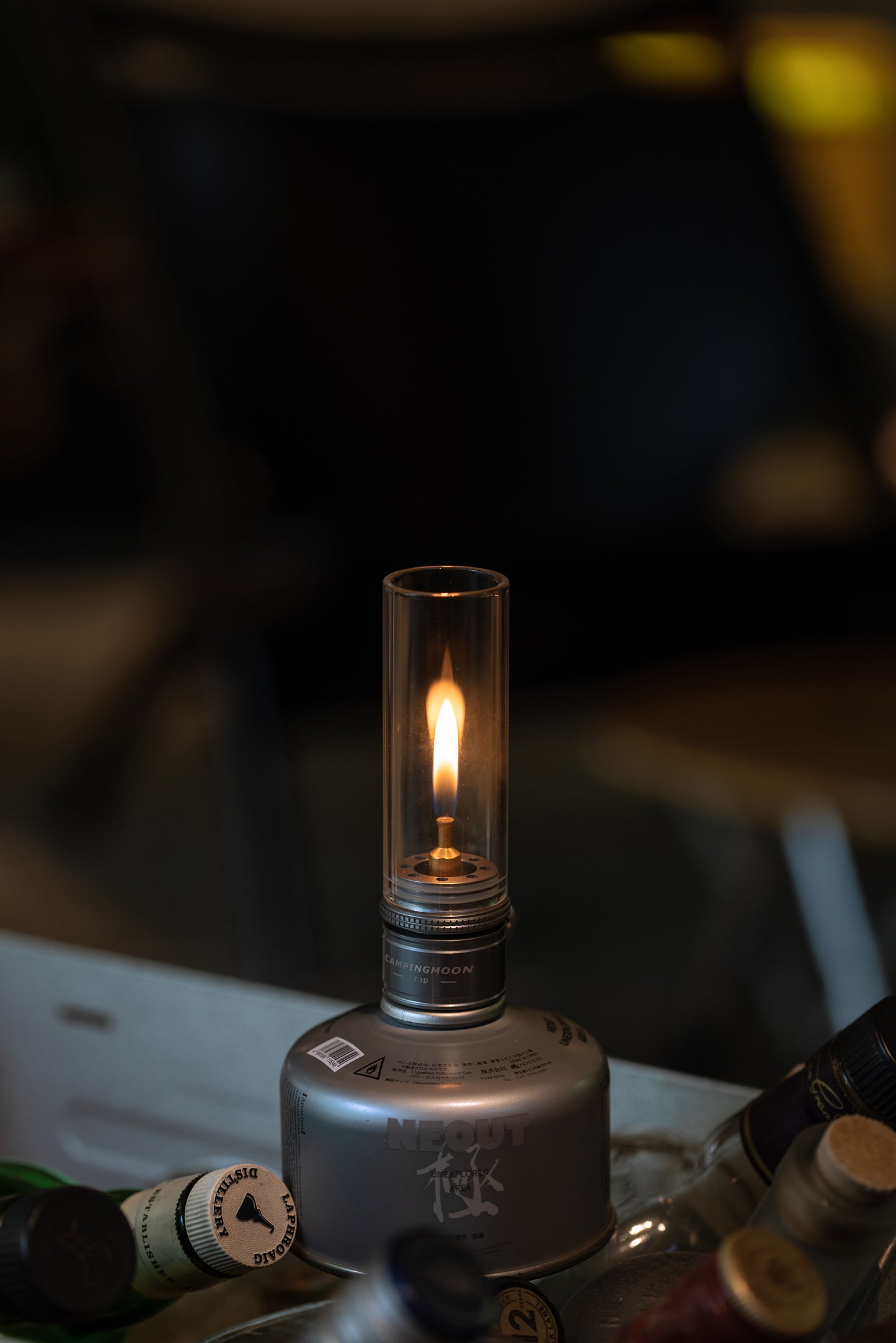 Nomadia Camping Light Atmospheric Camping gas Lamp with a visible flame on a dark background - glamping