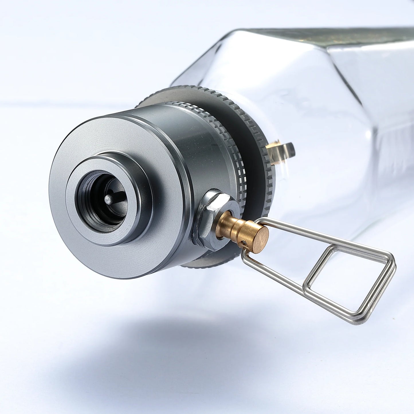 Close-up of a metal valve or fitting of the vintage styled camping light bulb with a white background - wildcamping - camping lamp