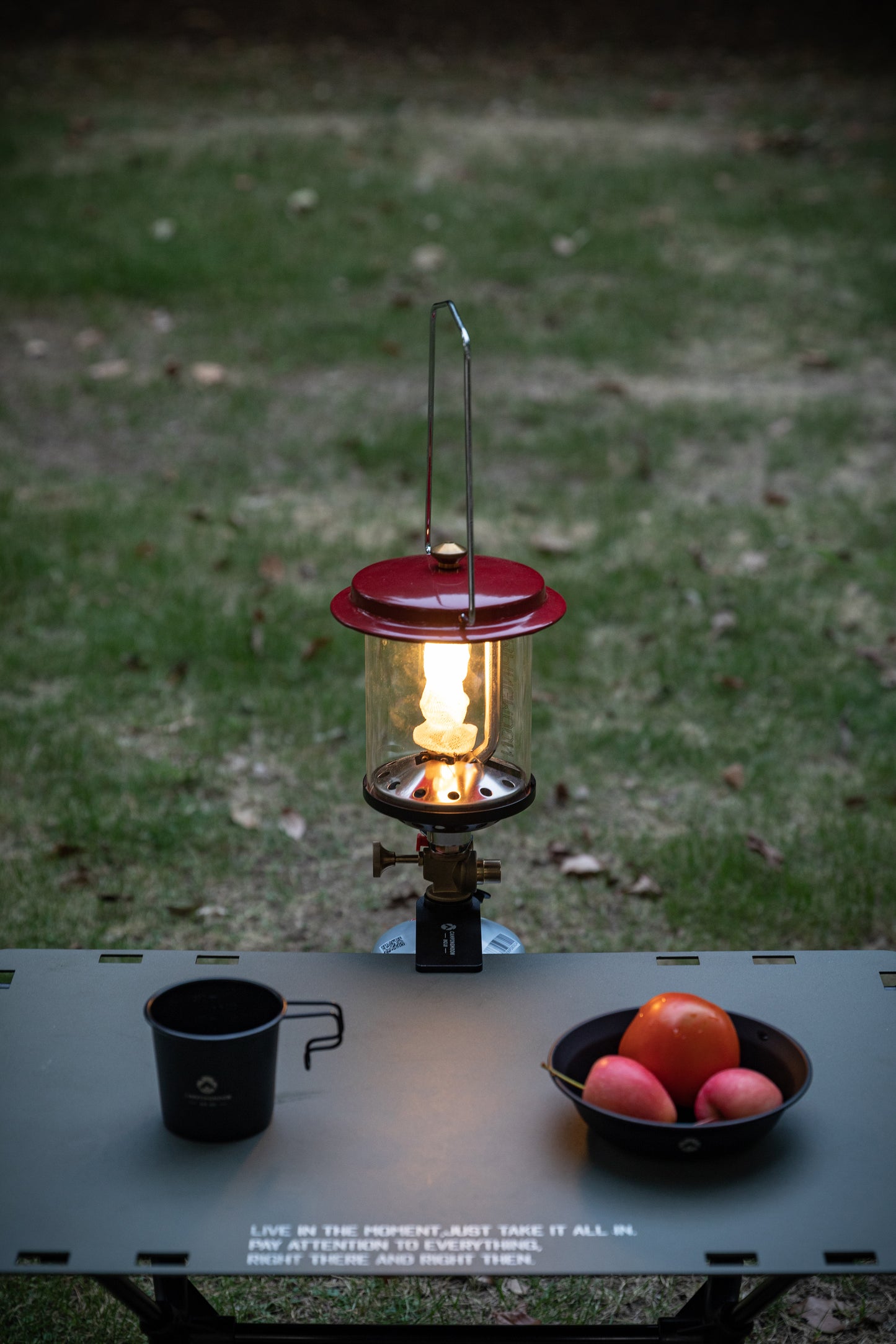 Nomadia Wild Camping Portable Lightweight Glamping Atmosphere Gas Lamp clipped to a camping table - camping setup - uk camping