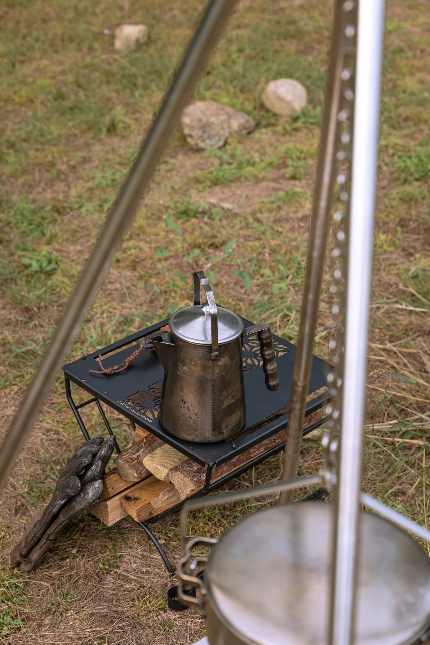 Nomadia Flamo Crafted Camping Kettle on a small camping table - camping essential - atmospheric