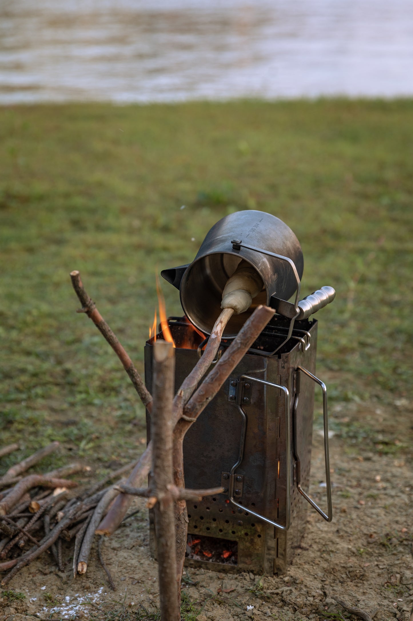 baking dough using Nomadia Flamo Crafted Camping Kettle over campfire - wild camping - camping with fire