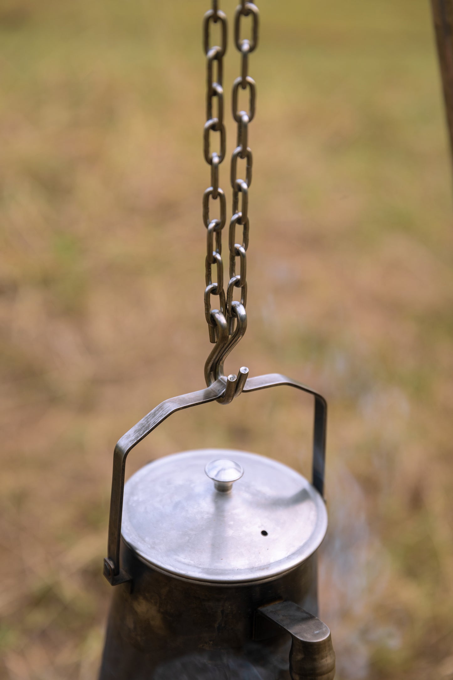 Nomadia Flamo Crafted Camping Kettle with lid hanging on a chain - wild camping