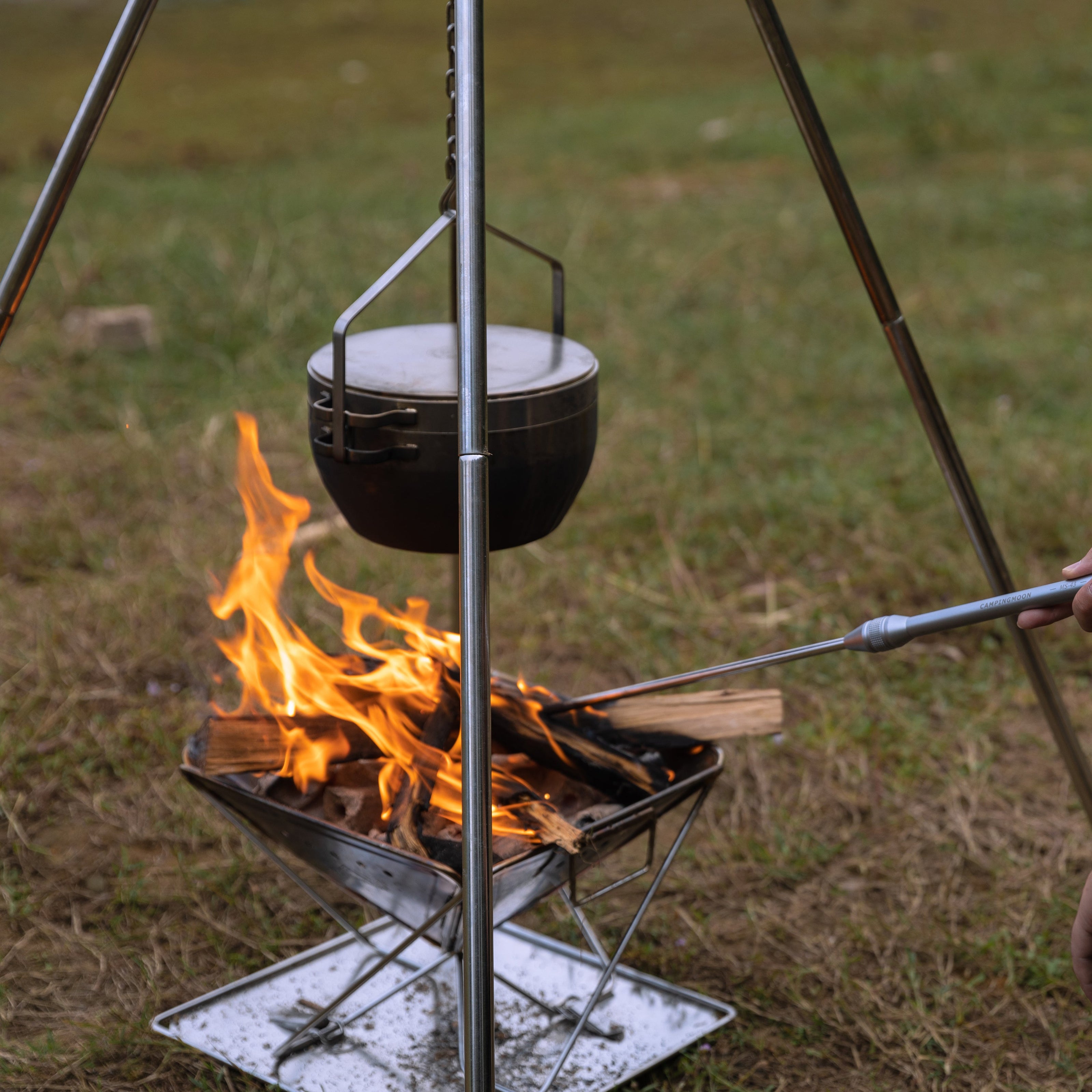 Nomadia Flamo Wild Camping Barbecue Campfire Glamp - Stainless Steel Quadripod - firepit - fire grill - outdoor gear - camping equipment - portable stove - open air - grassland - camping - firepit - campfire - camping with a fire