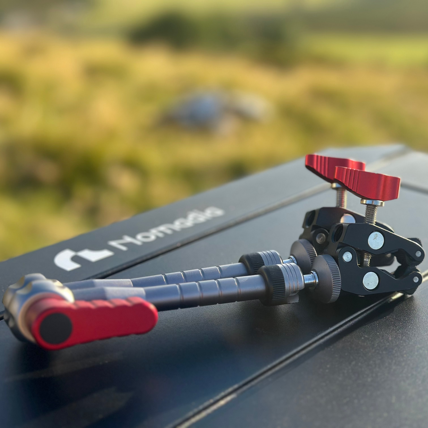 Camera stabilizer on a car roof Nomadia FlexArm Dual Clamp -camping gear - camping essential