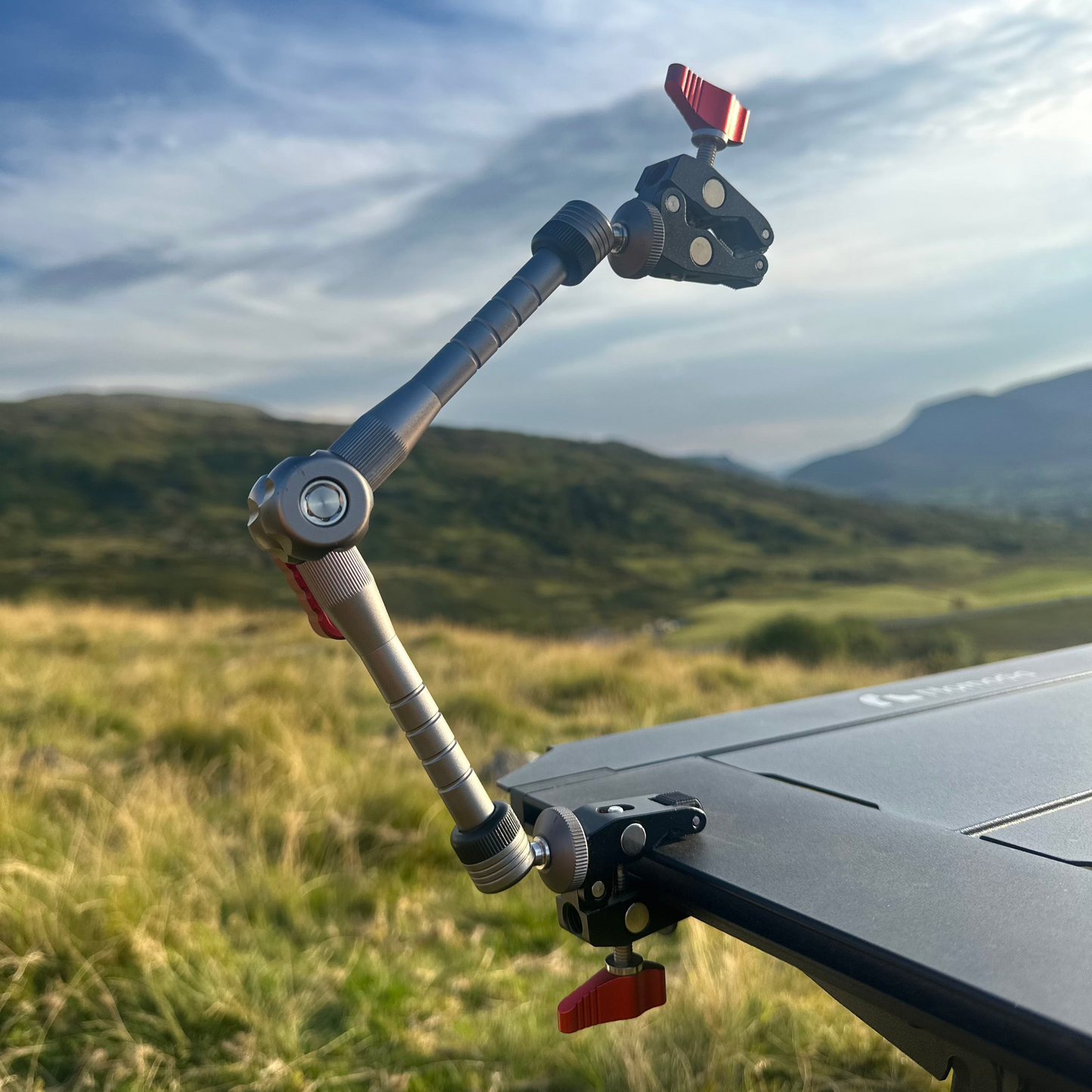 Camera stabilizer Nomadia FlexArm Dual Clamp on a modular camping table - camping essential - multi-use camping arm