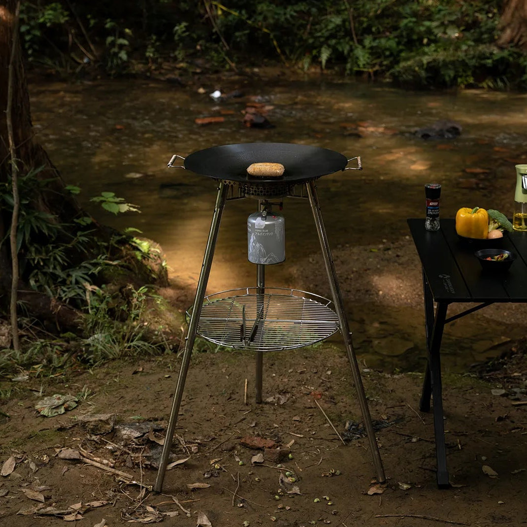 Nomadia Horizon Cook portable outdoor cooking station for sharing, with stove and grill included in a forest setting - portable grill pan - outdoor cookware for groups - multi-function camping stove