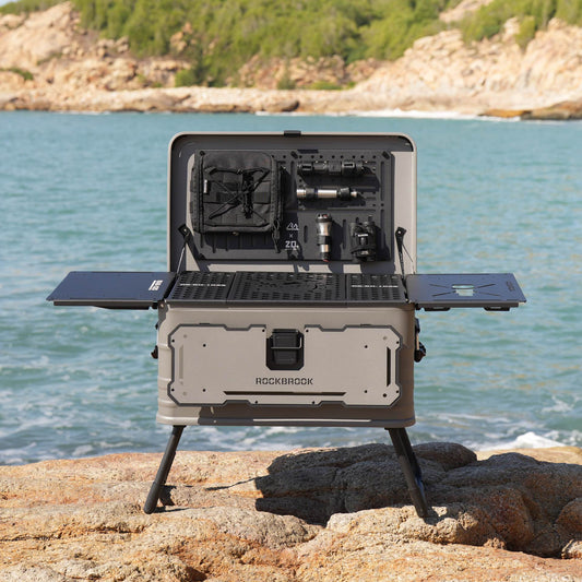 50L Nomadia ModoBox 2in1 camping table and storage box 1 with multiple compartments on a rocky beach - camping gear - glamping - uk camping