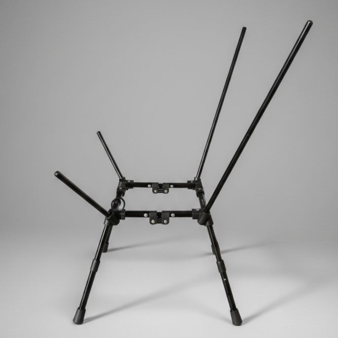 Black metal chair frame on a gray background