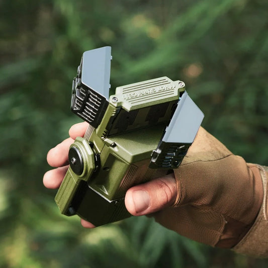 person holding forest green Nomadia Accessory All-in-One Outdoor Mosquito Repeller & Light, insertion socket for mosquito repellent pads - camping gear - camping light - insect repeller