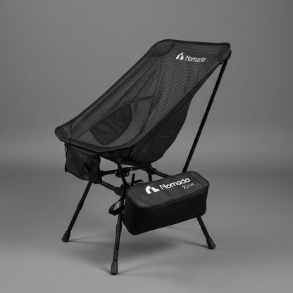 Black camping chair with carrying case on a gray background