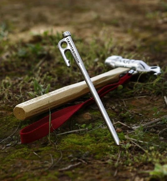 Nomadia Accessory Forged Camp Pegs and a hammer - camping essential - tent pegs - camping gear