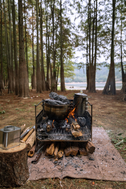 Campfire with Nomadia CampStation Stainless Steel Coffee Pot and wood in a forest setting - wild camping - outdoor cooking equipment - atmospheric camping