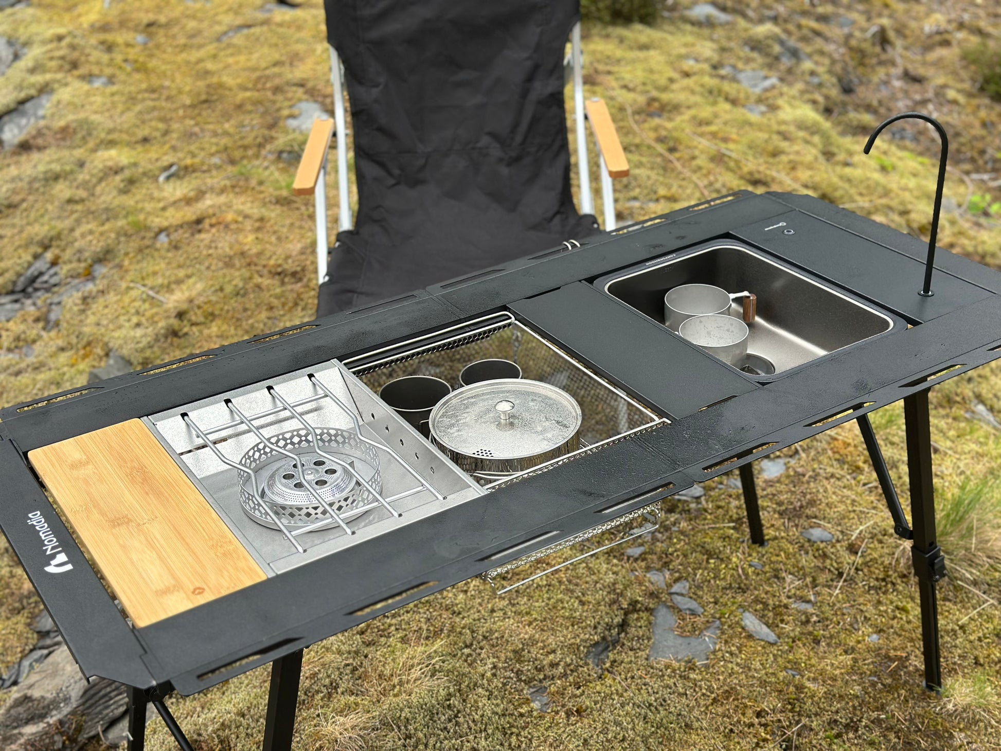 Nomadia_CampStation Portable Folding Heavy Duty Compact - Camping Table Table Set with Modular Flexibility - Modular Camping Table water dispenser - stainless steel coffee pot - stove set - sink - mesh basket - camping - lifestyle - grassland