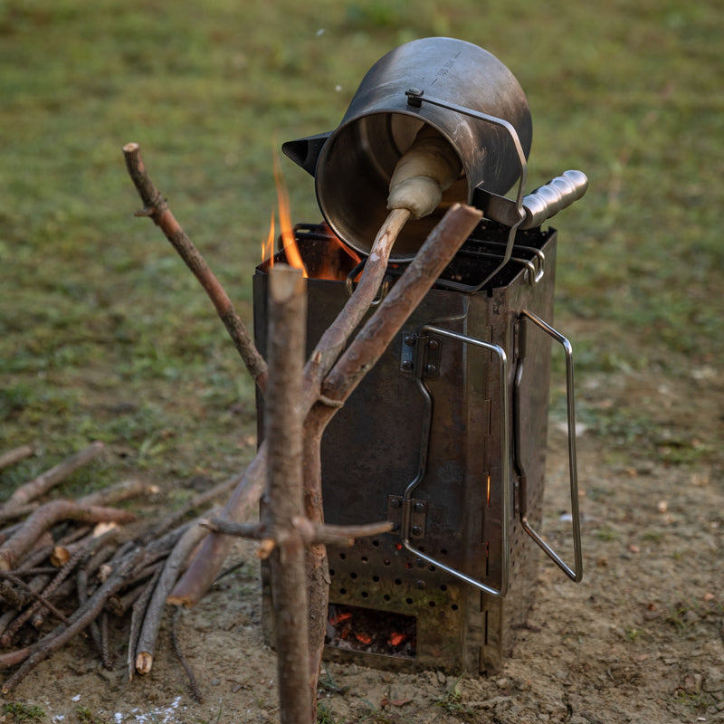 baking dough using Nomadia Flamo Crafted Camping Kettle over campfire - wild camping - camping with fire