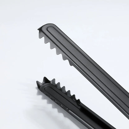 close up of the crocodile grip of Nomadia Flamo Wood Handle Heavy-Duty Outdoor Tongs - camping gear - camping essential - bbq grill accessory