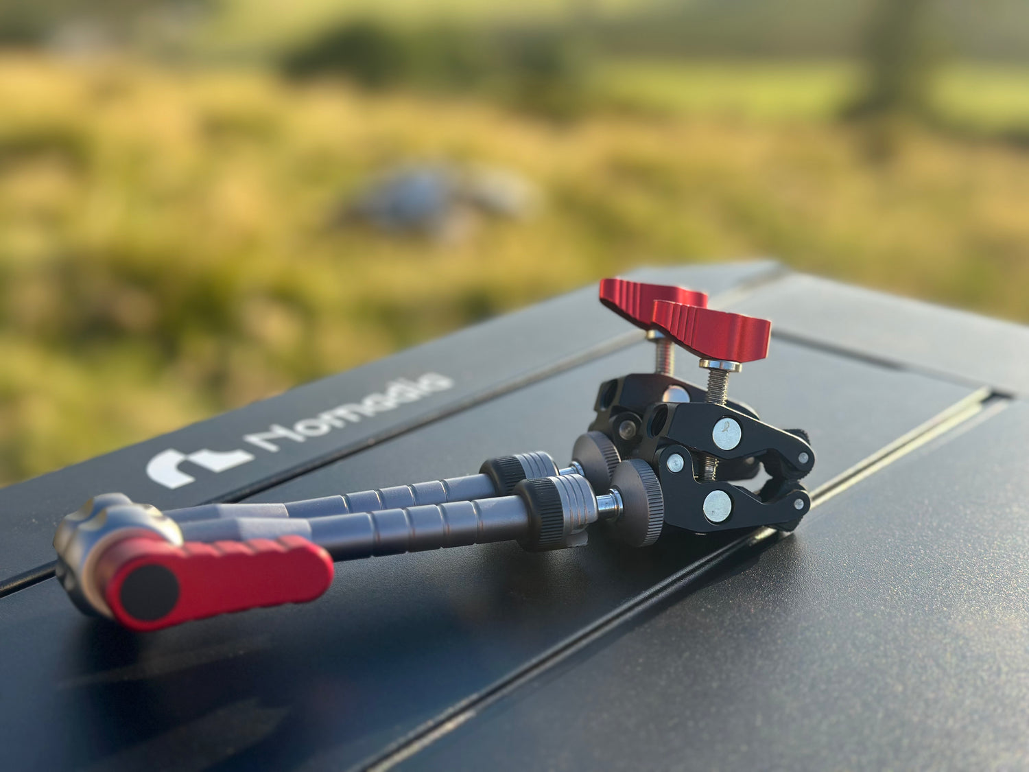 Camera stabilizer on a car roof Nomadia FlexArm Dual Clamp -camping gear - camping essential 