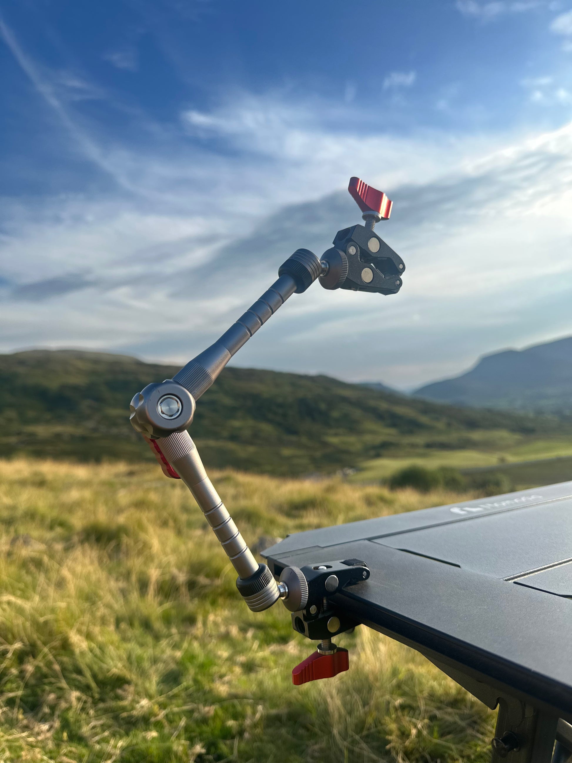Camera stabilizer Nomadia FlexArm Dual Clamp on a modular camping table - camping essential - multi-use camping arm