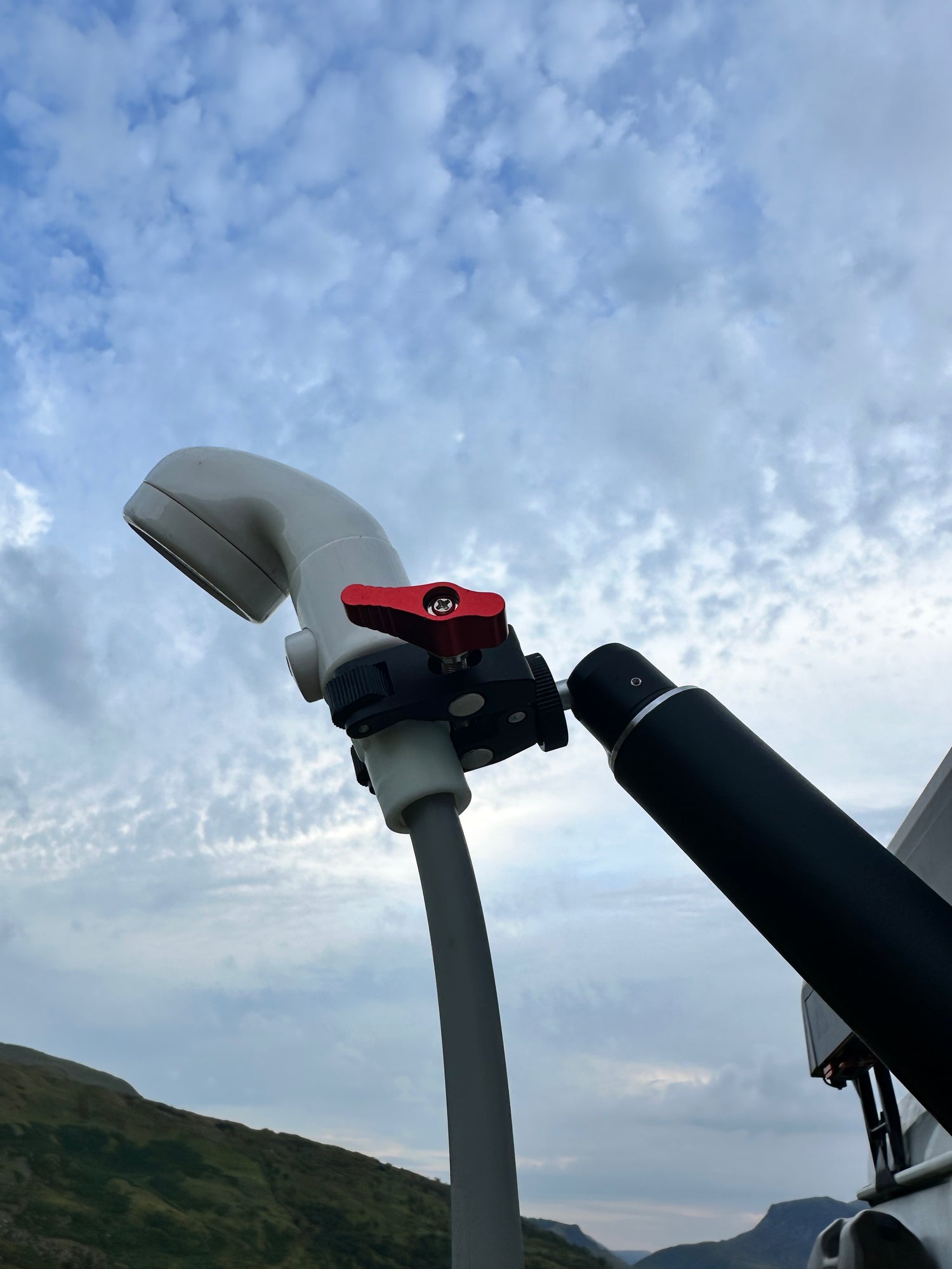 Nomadia thermoflow shower head connected to FlexMount Suction Arm for easy and comfortable shower outdoor - camping gear - camping and survival
