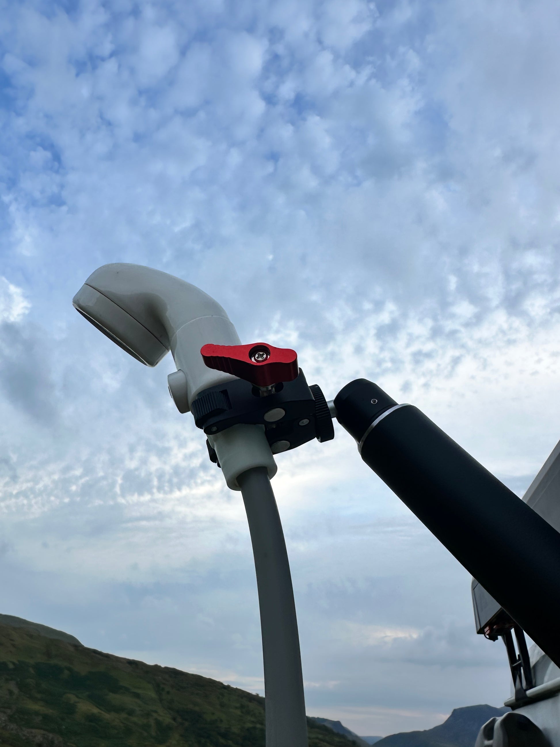 Nomadia thermoflow shower head connected to FlexMount Suction Arm for easy and comfortable shower outdoor - camping gear - camping and survival