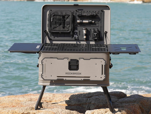 50L Nomadia ModoBox 2in1 camping table and storage box 1 with multiple compartments on a rocky beach - camping gear - glamping - uk camping