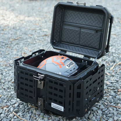 Black hard-shell protective case Nomadia ModoBox ArmorFold 45 Motorcycle Trunk Camping Table with a helmet inside - large storage crate for overlanding uk