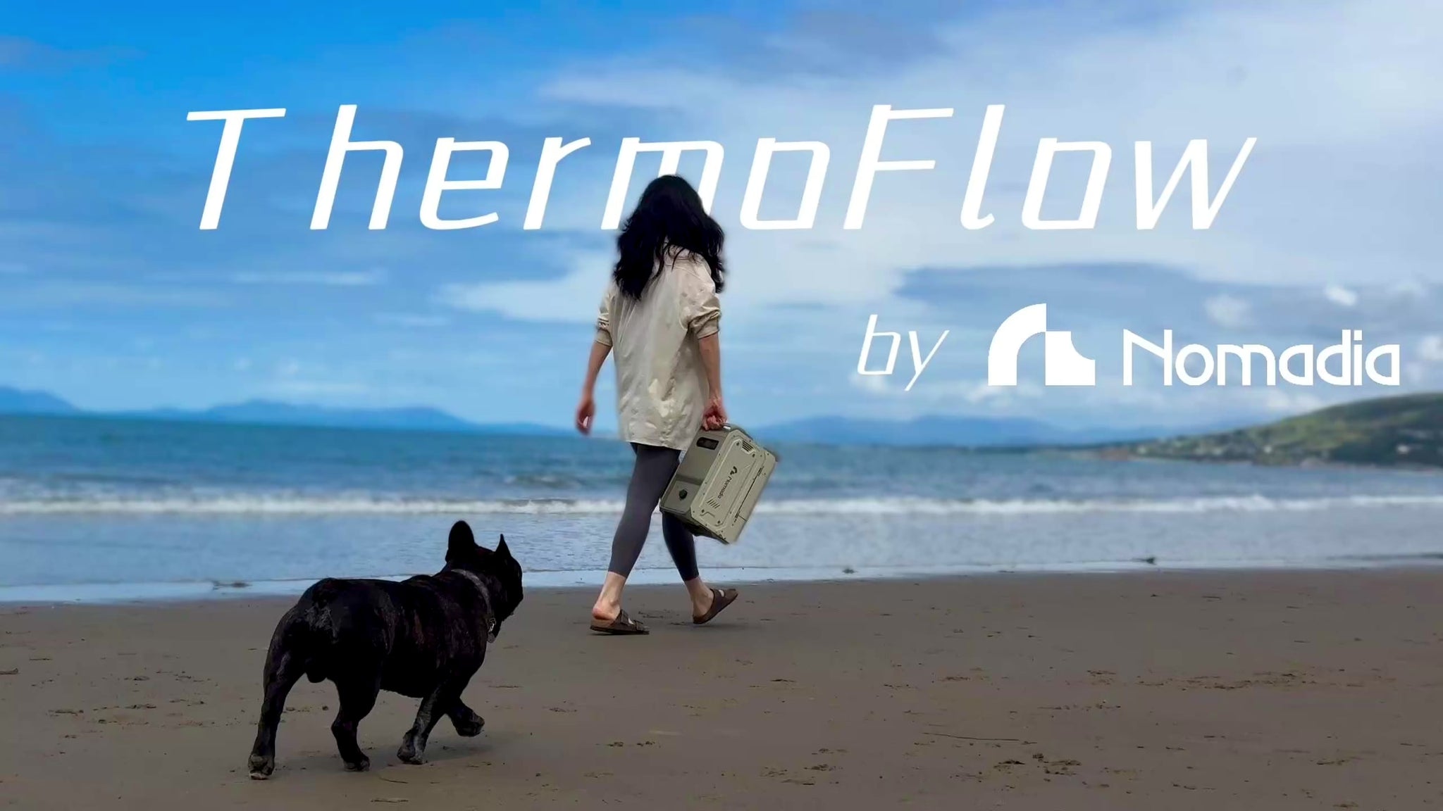 portable heated shower system ThermoFlow used by the sea to wash up muddy dogs